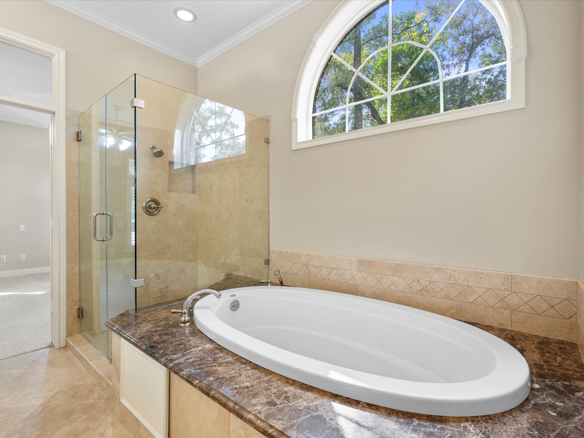 7 Wellesley Drive Conroe, TX 77304 - Photo 14 of 34 a bathroom with a granite countertop bathtub and shower
