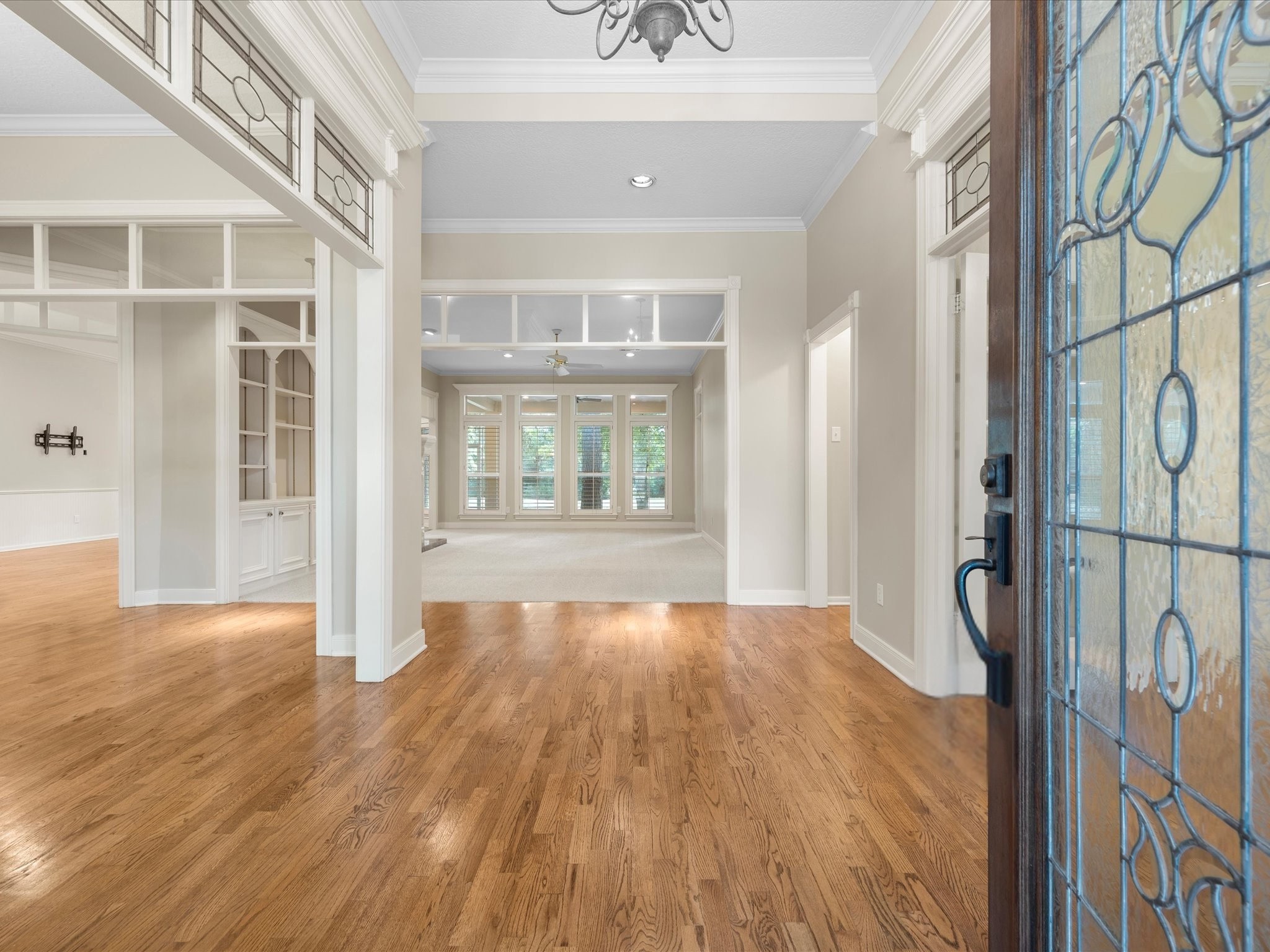 7 Wellesley Drive Conroe, TX 77304 - Photo 2 of 34 a view of an empty room with wooden floor and a window