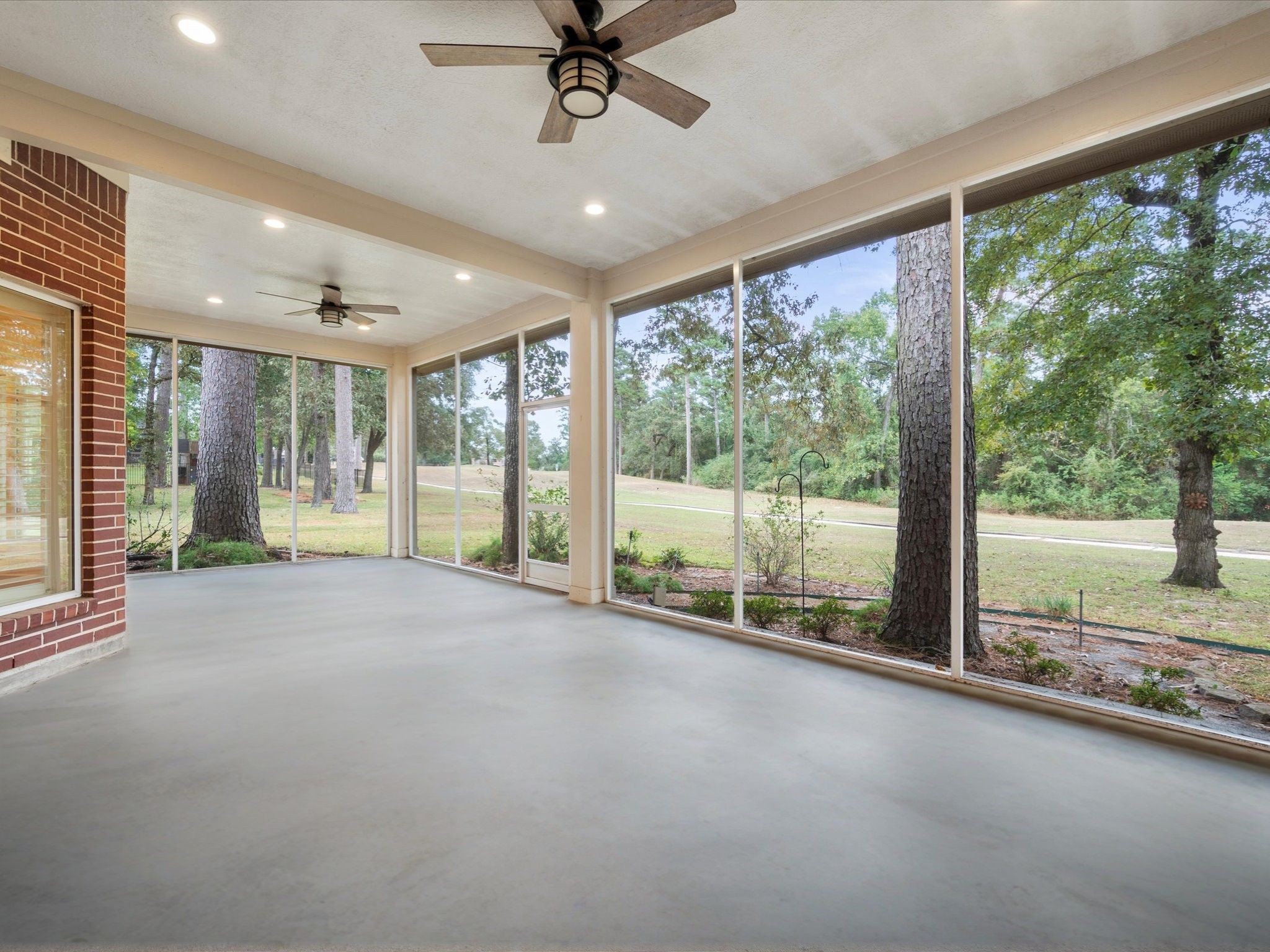 7 Wellesley Drive Conroe, TX 77304 - Photo 24 of 34 a view of an empty room with a large window