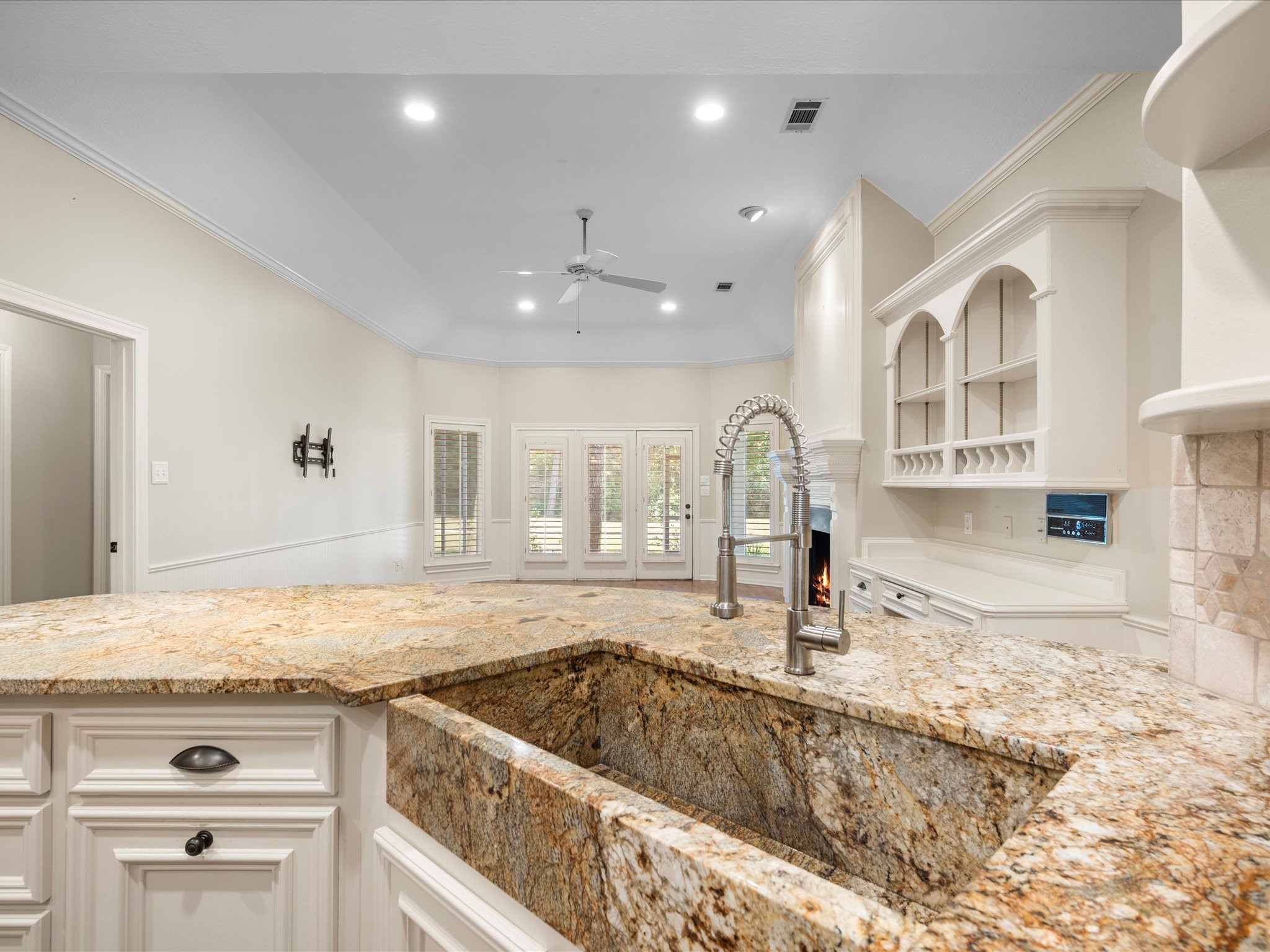 7 Wellesley Drive Conroe, TX 77304 - Photo 7 of 34 a kitchen with a sink and a stove top oven