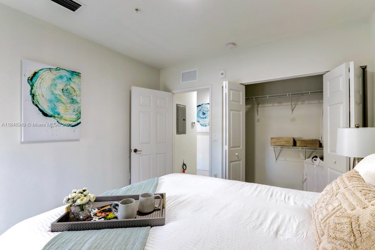 339 West 78th Road, Unit 203 Hialeah, FL 33014 - Photo 11 of 23 a bedroom with a bed and hallway
