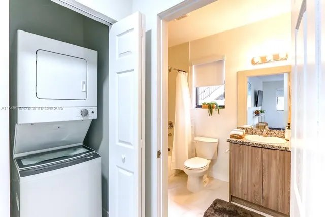a kitchen with a refrigerator sink and microwave
