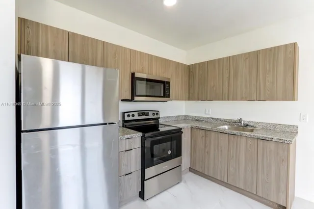 a view of empty room with windows