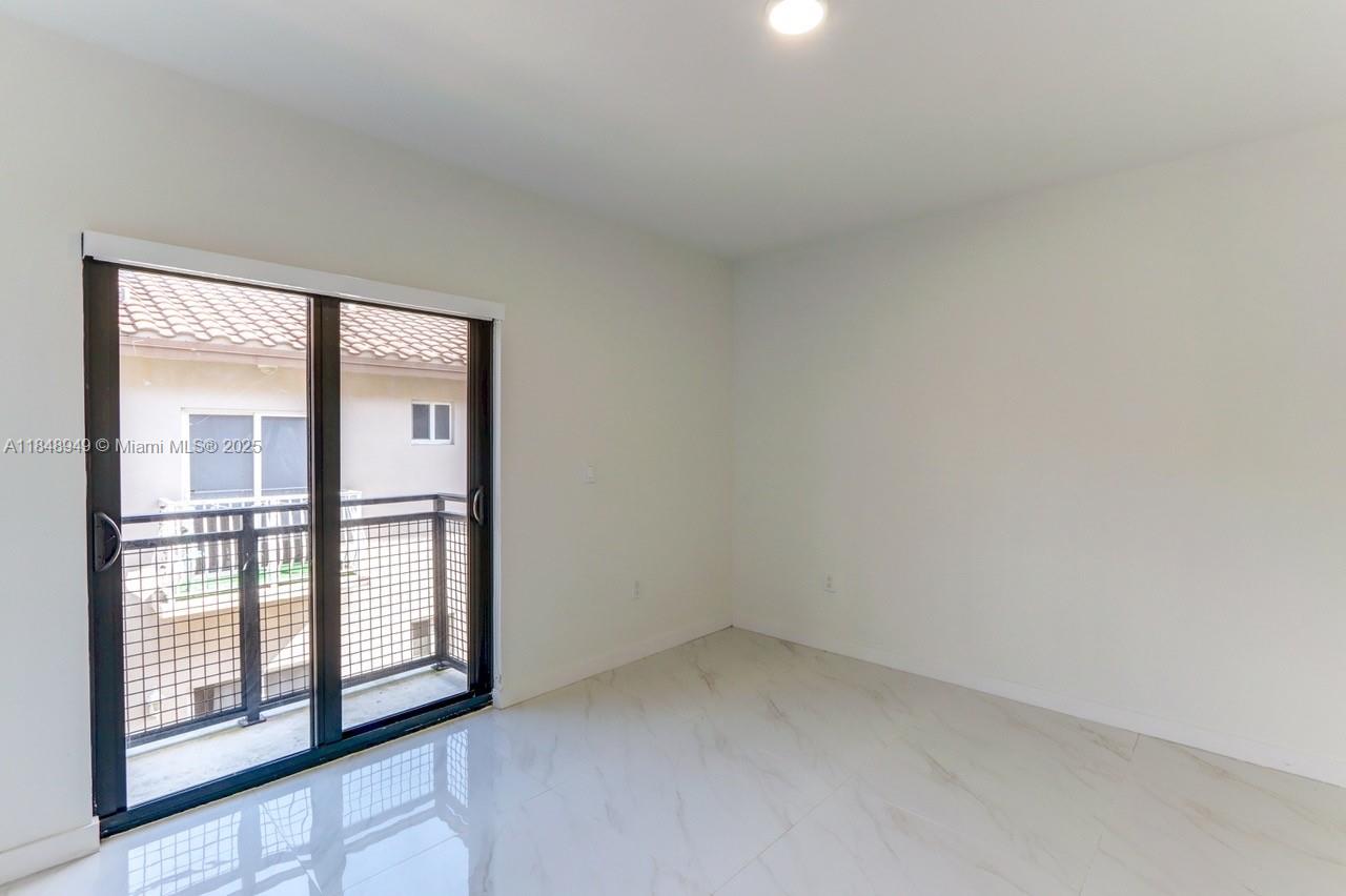 339 West 78th Road, Unit 203 Hialeah, FL 33014 - Photo 14 of 23 a view of empty room with windows