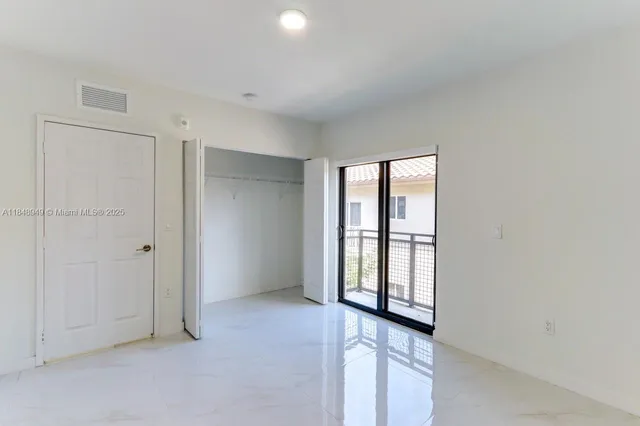 a view of a kitchen with a sink and dishwasher a refrigerator a fireplace