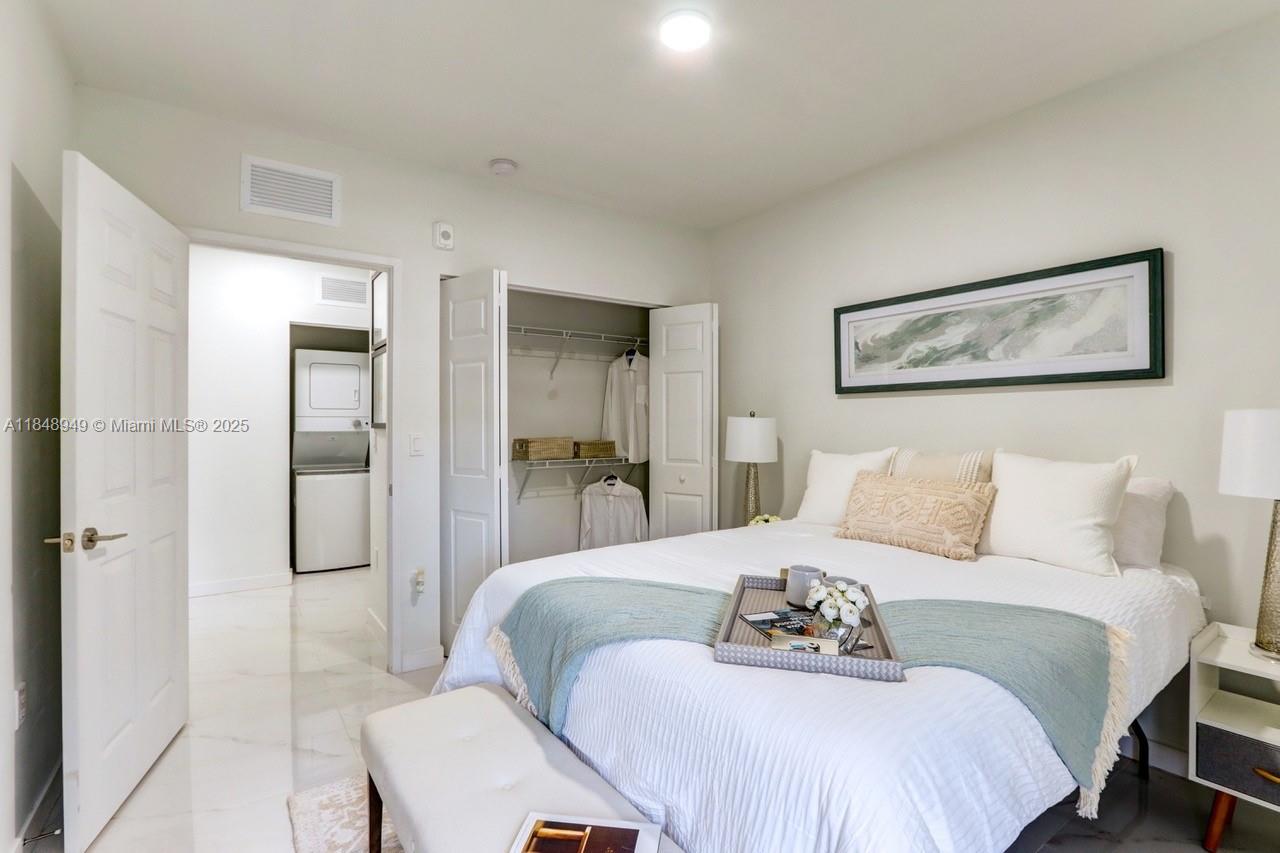 339 West 78th Road, Unit 203 Hialeah, FL 33014 - Photo 10 of 23 a bedroom with a bed and a painting on the wall