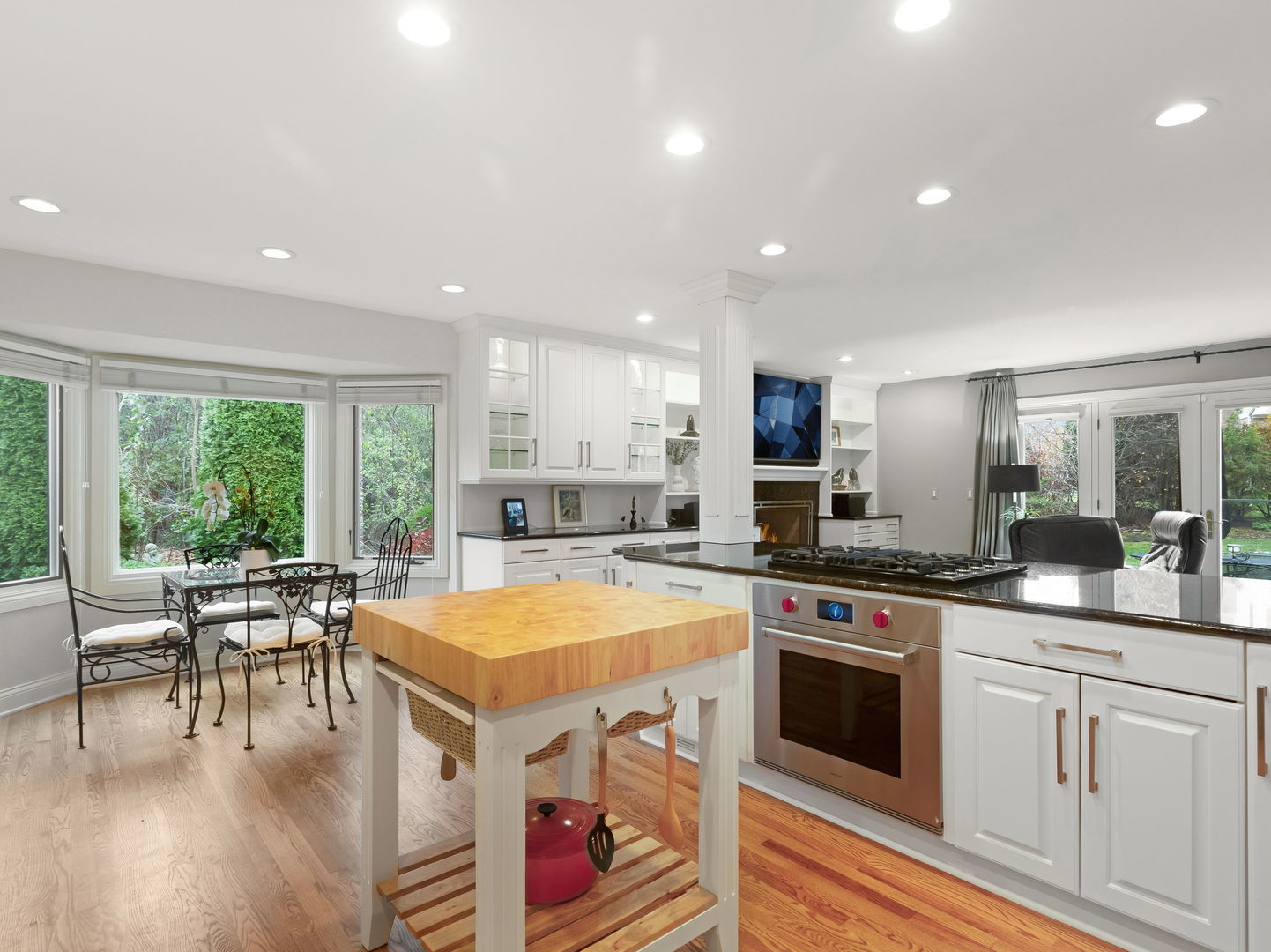 694 Buena Road Lake Forest, IL 60045 - Photo 11 of 39 a kitchen with a stove a white table and chairs