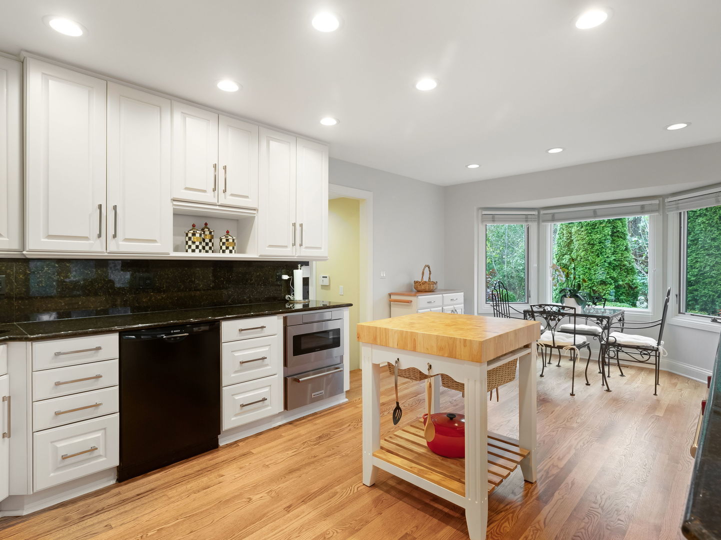 694 Buena Road Lake Forest, IL 60045 - Photo 12 of 39 a kitchen with a table chairs stove and cabinets