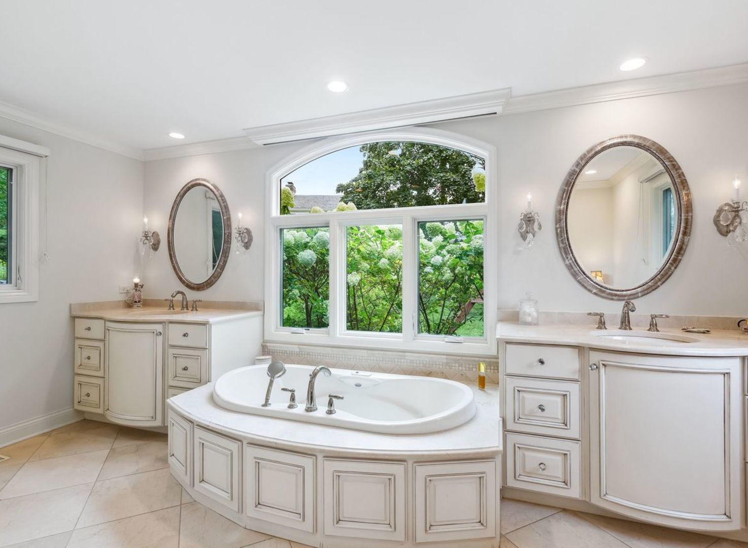 694 Buena Road Lake Forest, IL 60045 - Photo 17 of 39 a bathroom with a granite countertop sink a mirror and a bathtub