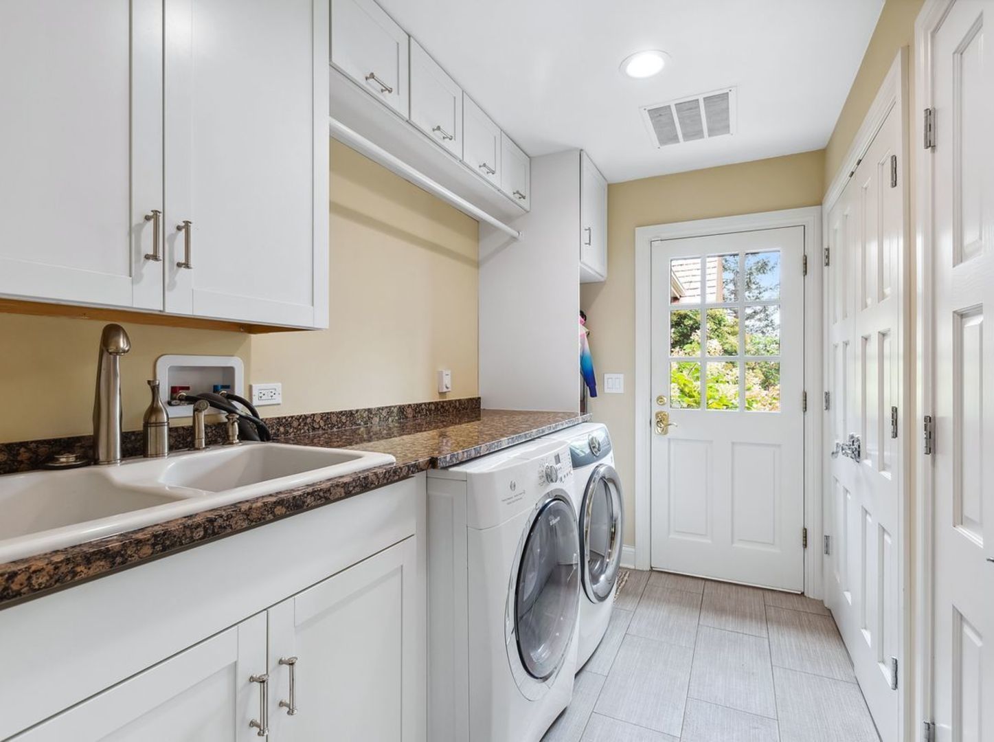 694 Buena Road Lake Forest, IL 60045 - Photo 19 of 39 a utility room with cabinets washer and dryer
