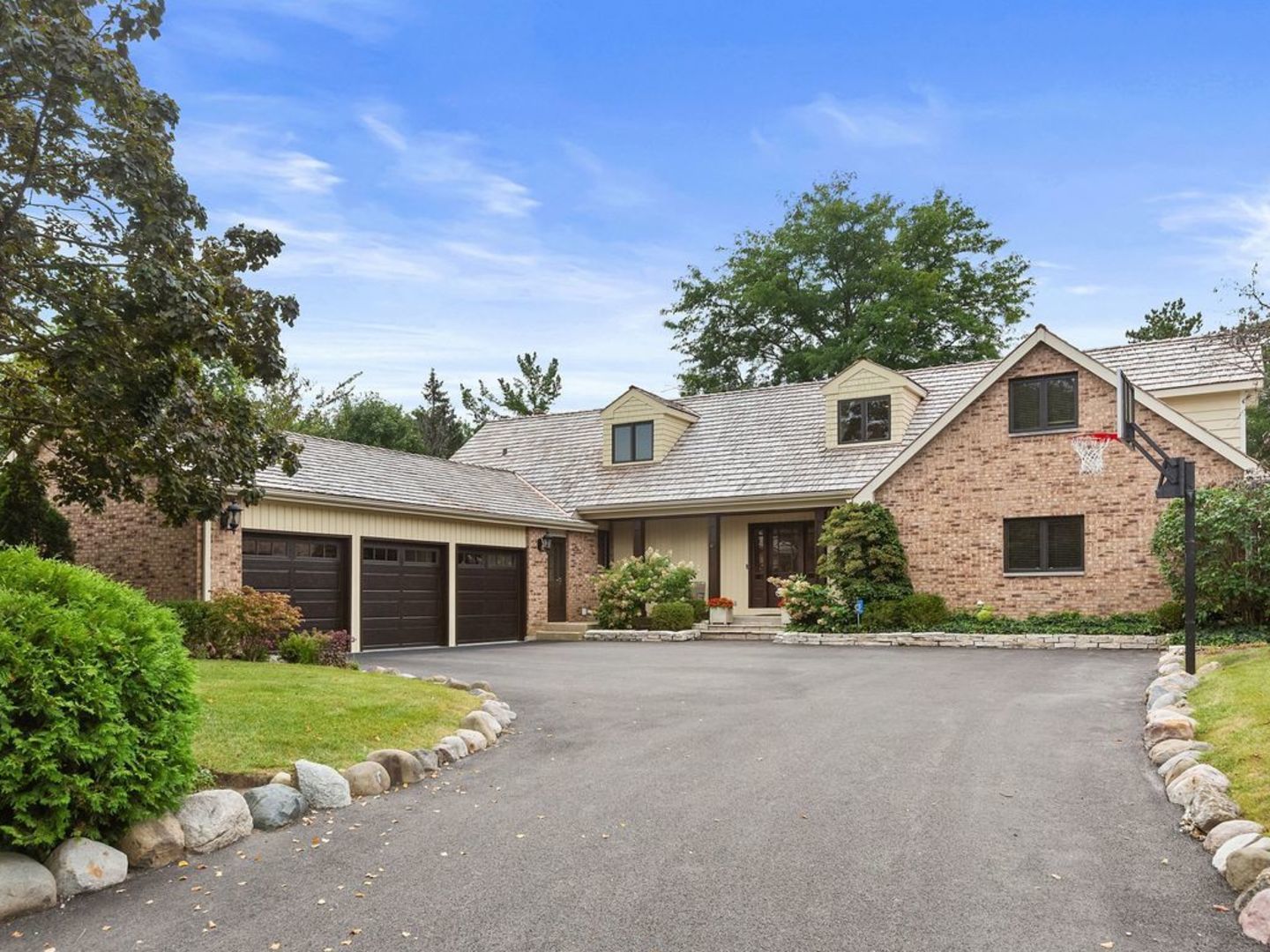694 Buena Road Lake Forest, IL 60045 - Photo 2 of 39 a front view of a house with a yard and garage