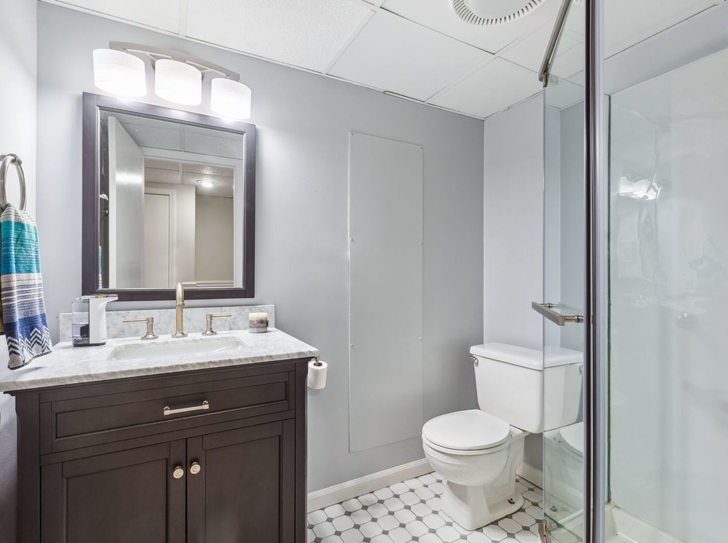 694 Buena Road Lake Forest, IL 60045 - Photo 31 of 39 a bathroom with a sink vanity mirror and toilet