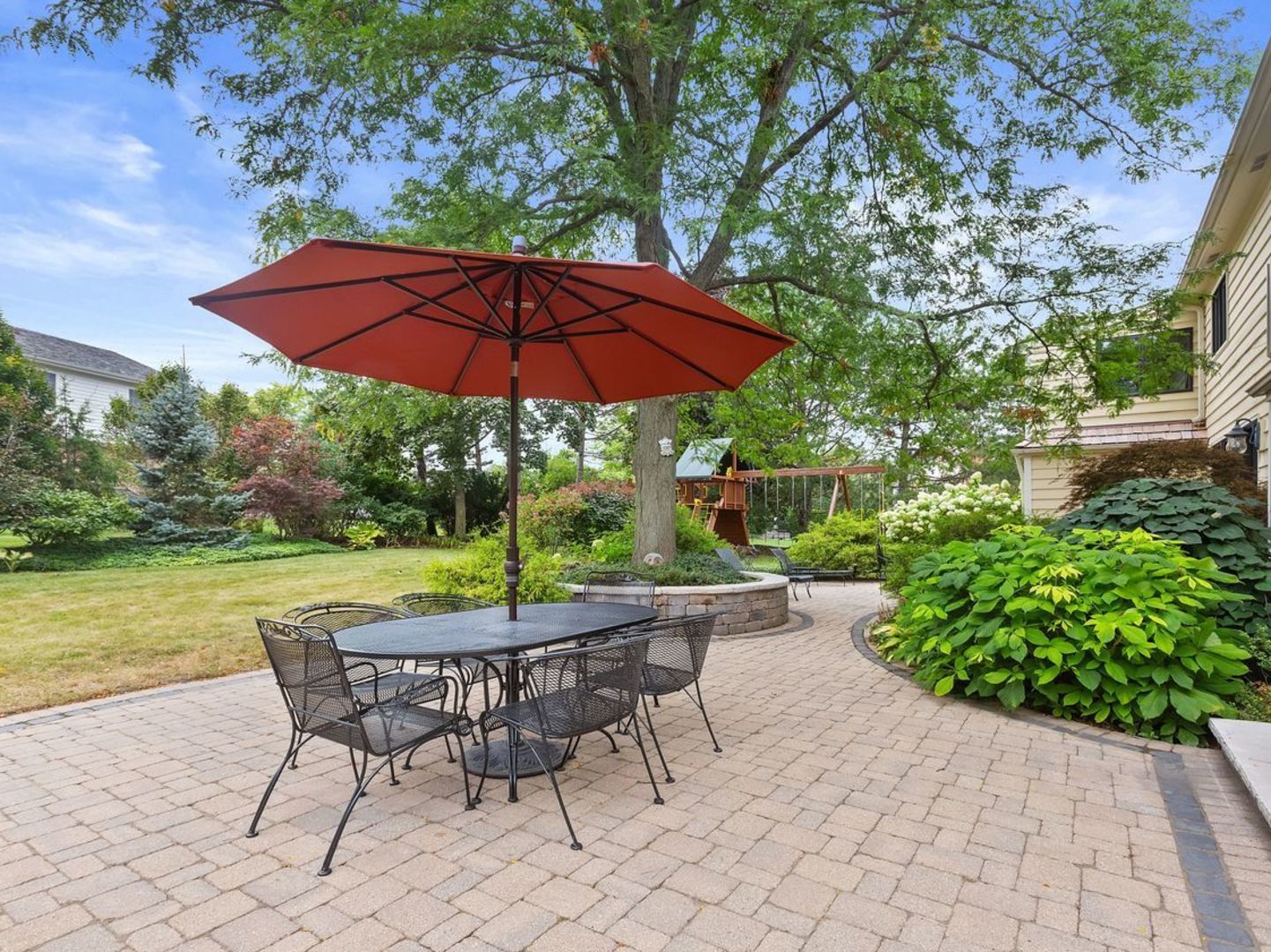 694 Buena Road Lake Forest, IL 60045 - Photo 32 of 39 a view of a table and chairs under an umbrella in the patio