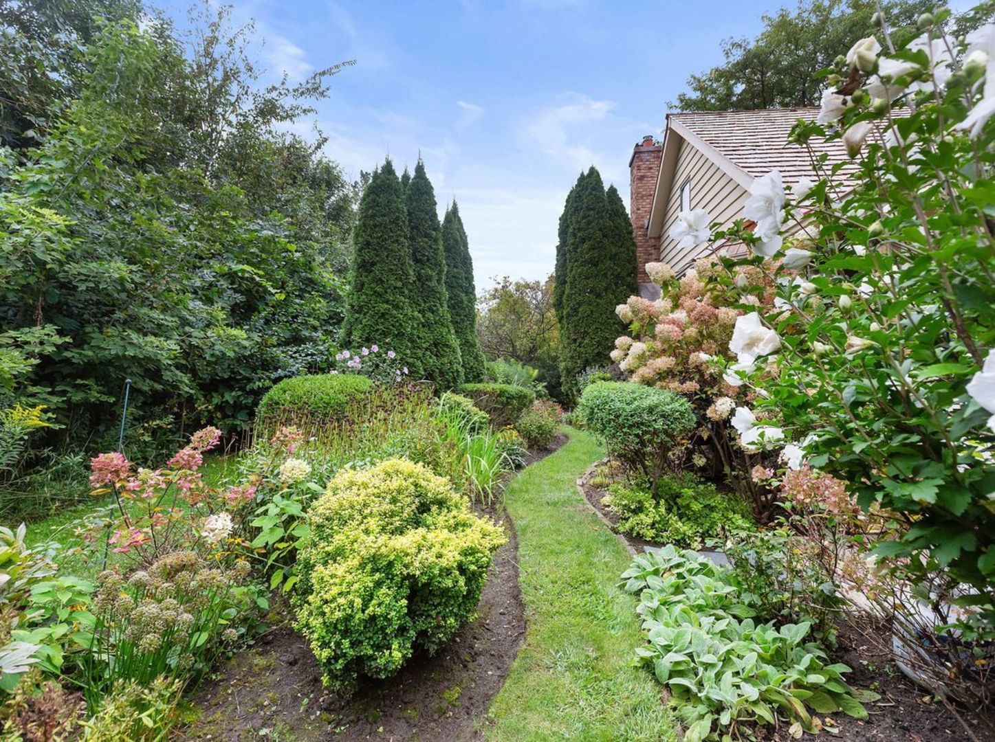 694 Buena Road Lake Forest, IL 60045 - Photo 36 of 39 a backyard of a house with a yard and outdoor seating