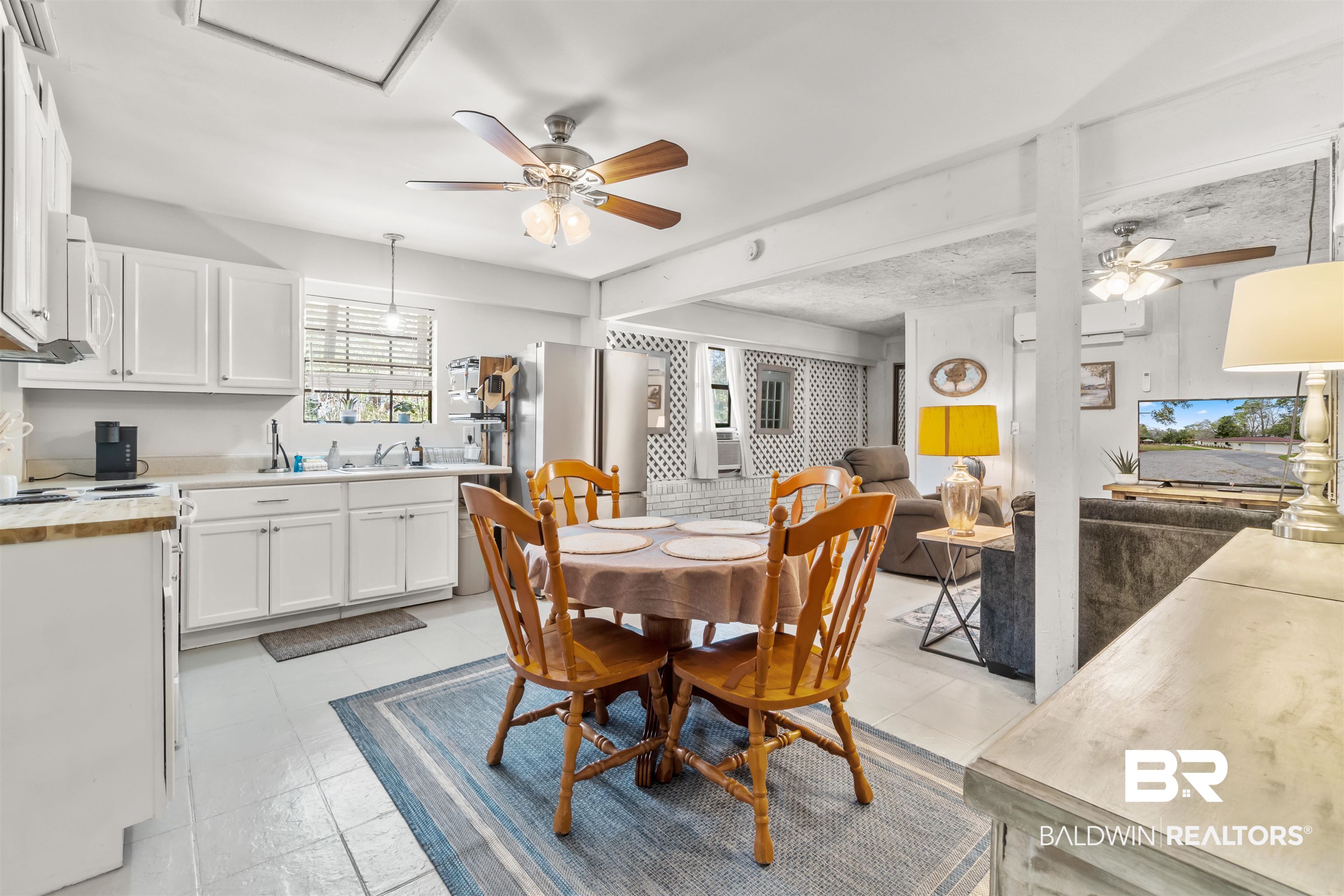 17595 River Road Summerdale, AL 36580 - Photo 7 of 29 Dining room featuring ceiling fan and a wall mounted mini split