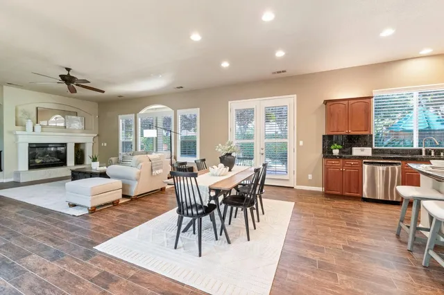 a view of a dining room with furniture window and wooden floor