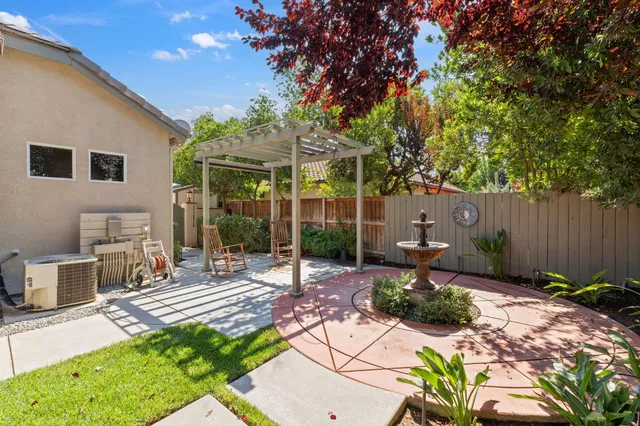 a view of a backyard with sitting area