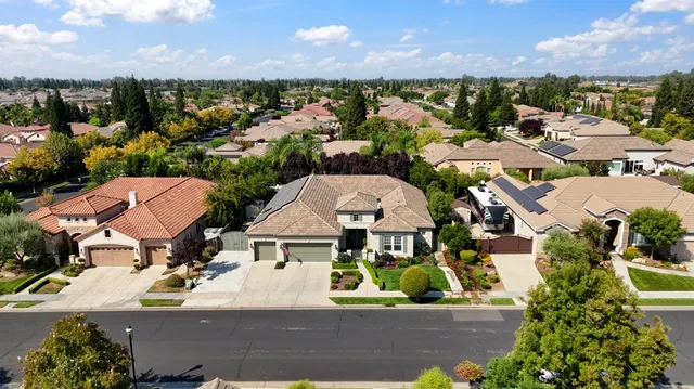 an aerial view of a house with a garden