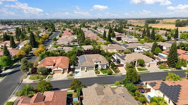 an aerial view of a houses with outdoor space