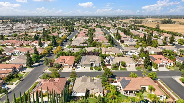 front view of a house with potted plants