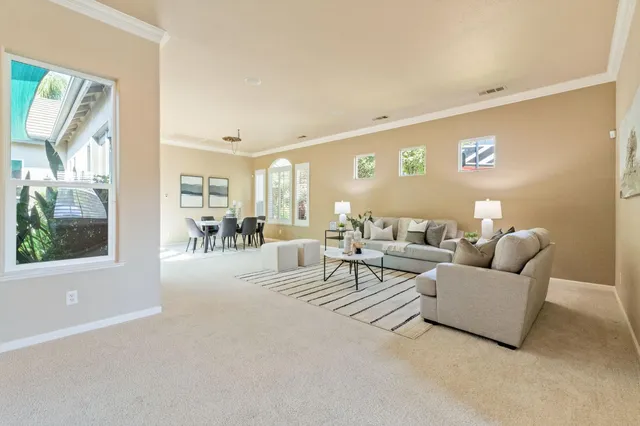 a living room with furniture and a table