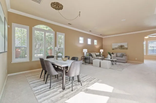 a view of a dining room with furniture window and outside view