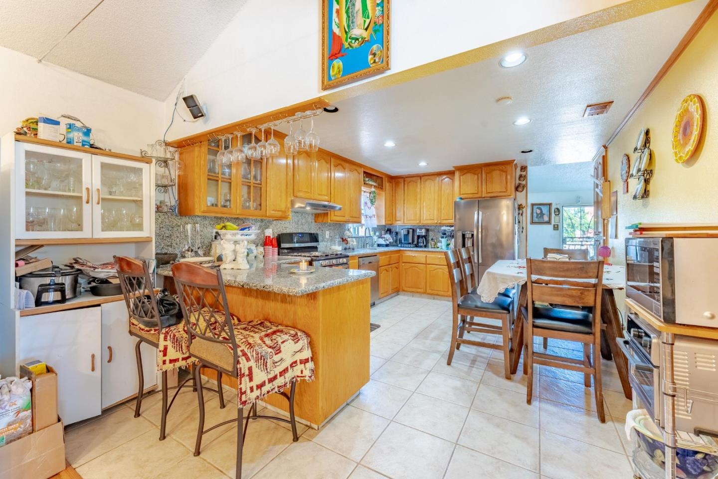 2776 Cramer Circle San Jose, CA 95111 - Photo 11 of 22 a dining hall with stainless steel appliances a dining table and chairs