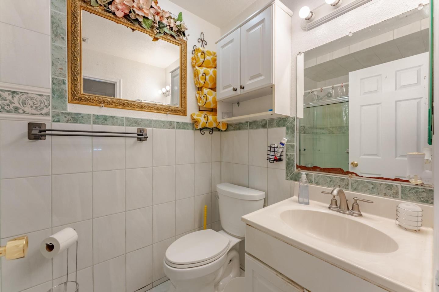 2776 Cramer Circle San Jose, CA 95111 - Photo 14 of 22 a bathroom with a sink a toilet and a mirror
