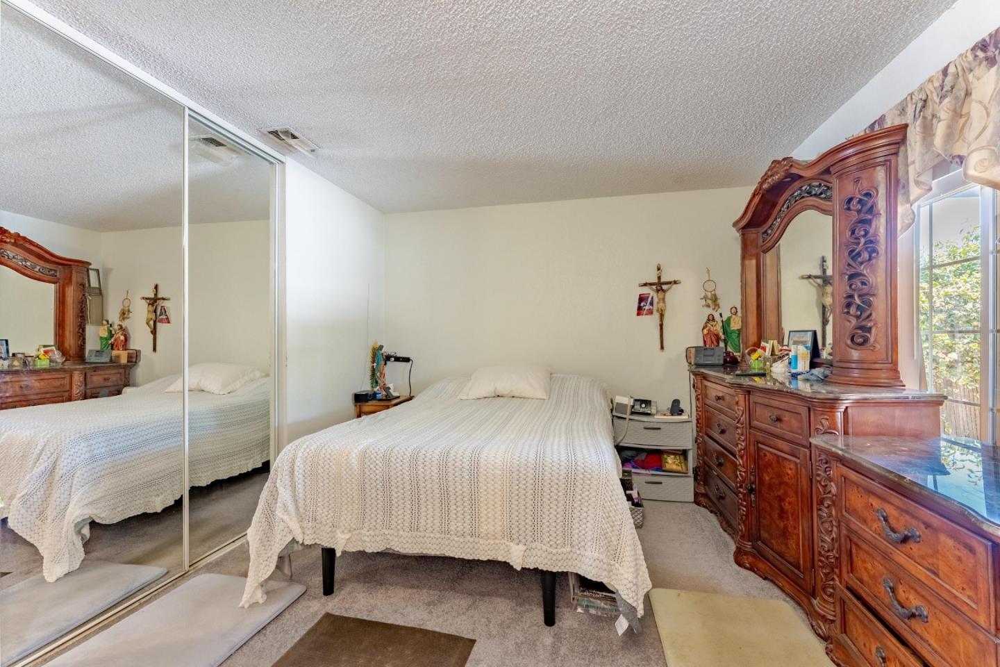 2776 Cramer Circle San Jose, CA 95111 - Photo 17 of 22 a bedroom with a bed and dresser with mirror
