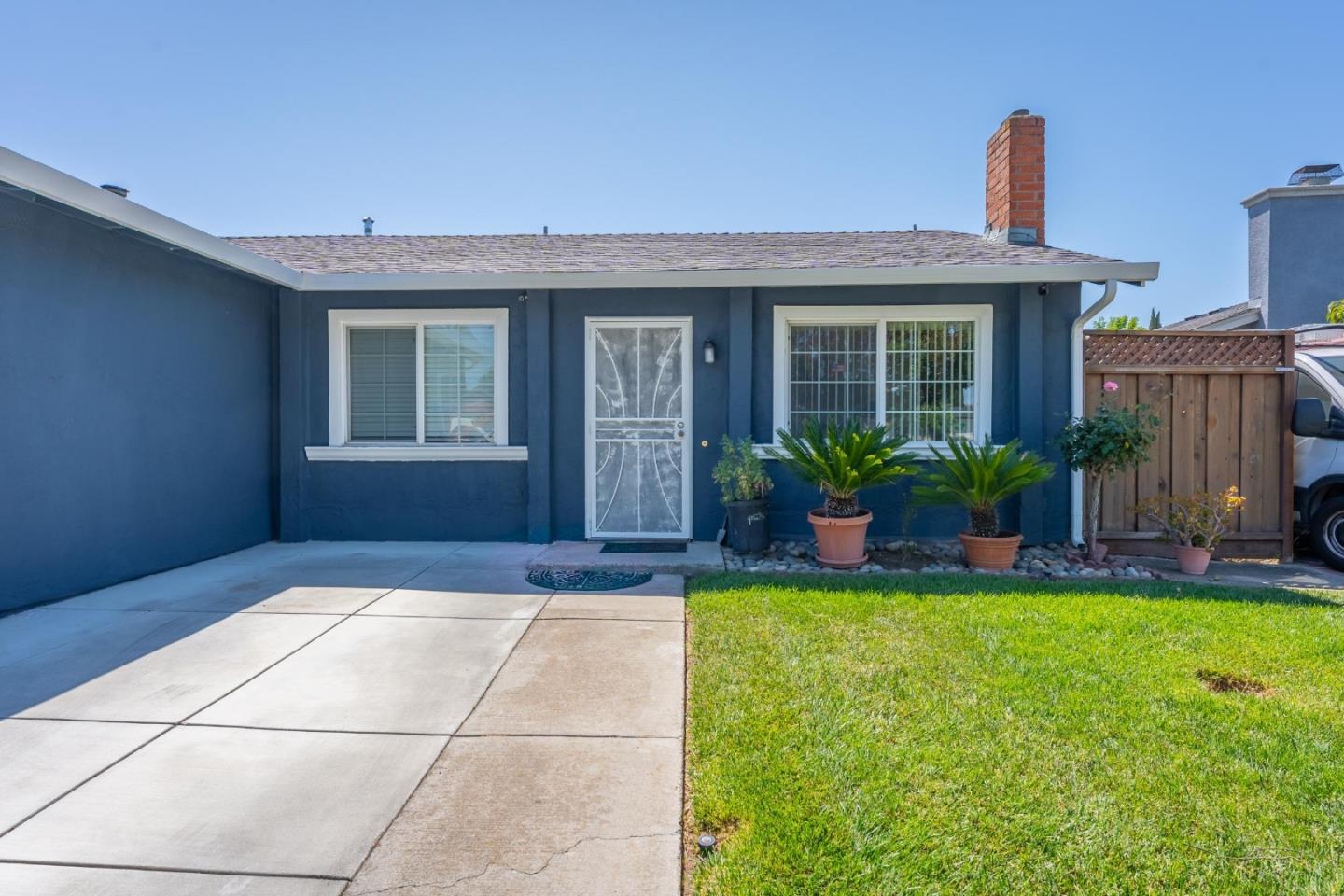 2776 Cramer Circle San Jose, CA 95111 - Photo 3 of 22 a front view of a house with a yard and potted plants