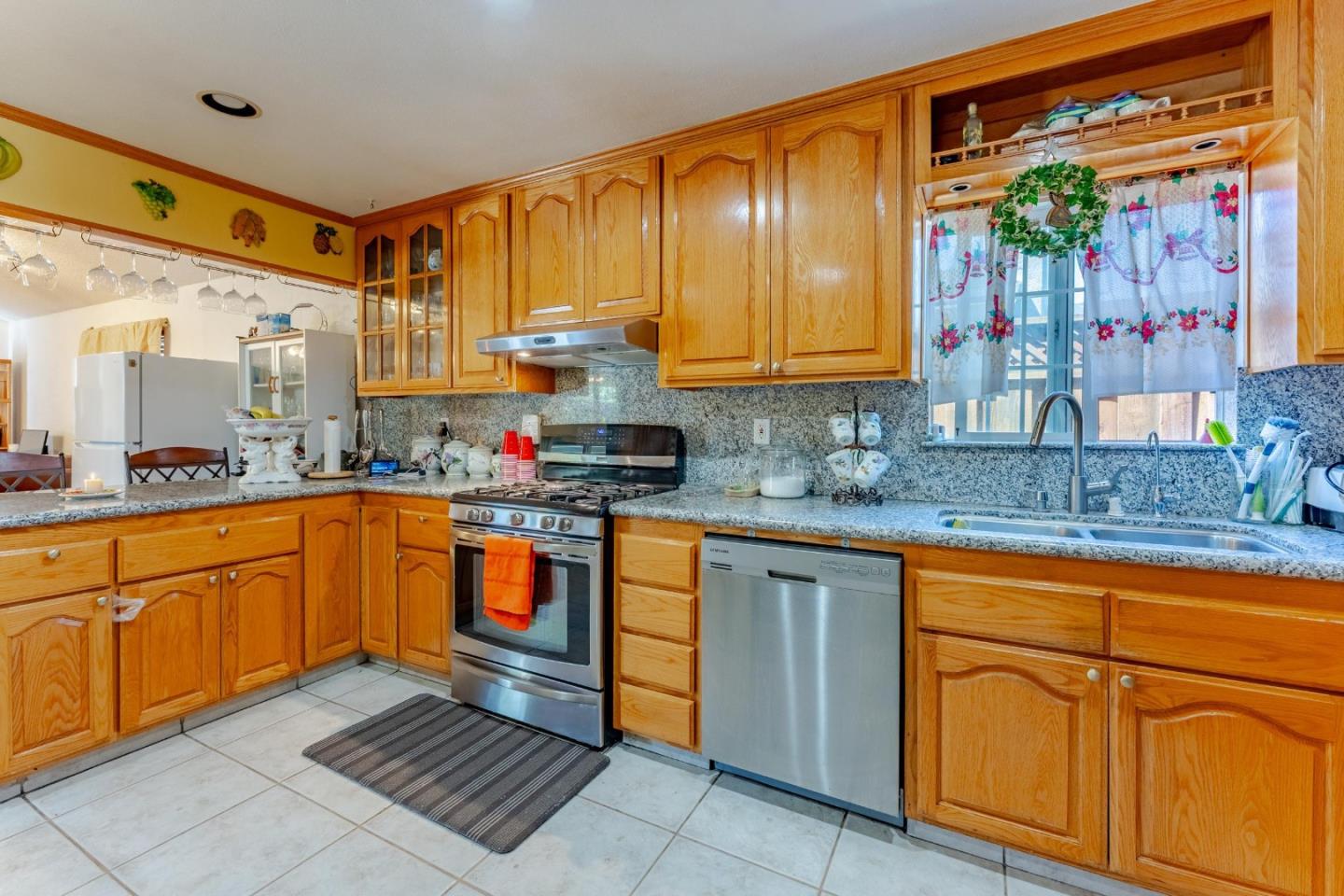 2776 Cramer Circle San Jose, CA 95111 - Photo 6 of 22 a kitchen with stainless steel appliances granite countertop wooden cabinets a sink and dishwasher