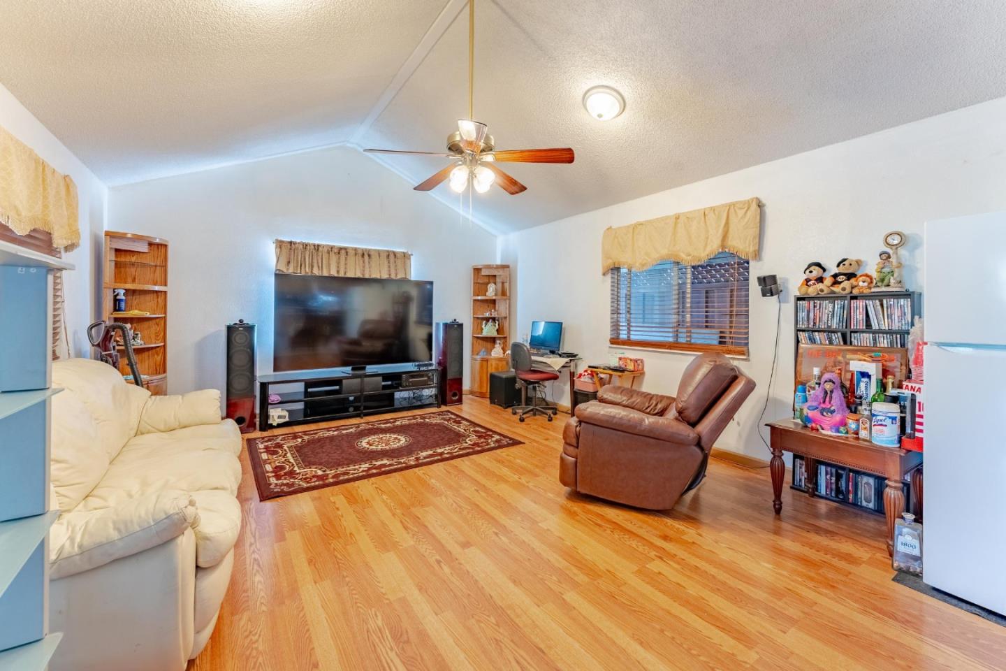 2776 Cramer Circle San Jose, CA 95111 - Photo 9 of 22 a living room with furniture and a flat screen tv