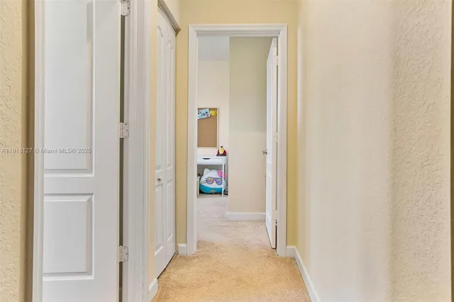 a view of a livingroom and a hallway