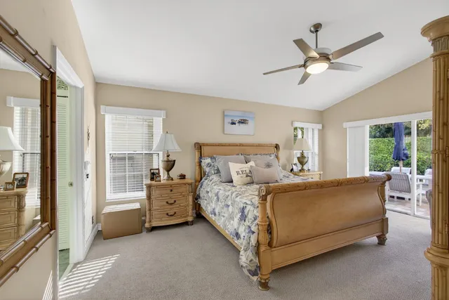 a bed room with a bed and a window