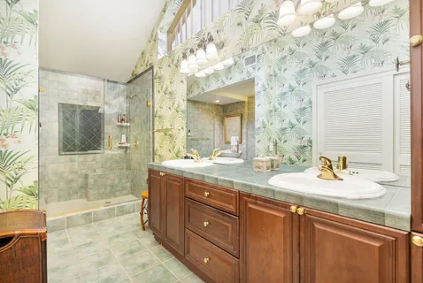 a bath room with a sink and a mirror