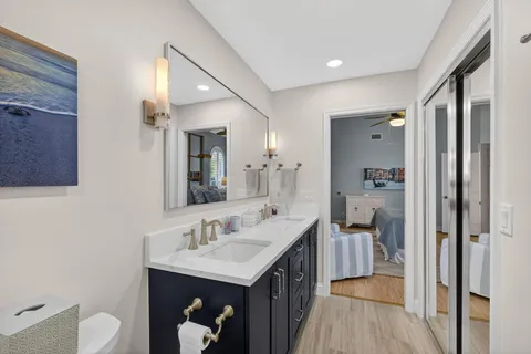 a en suite bathroom with a sink and a mirror