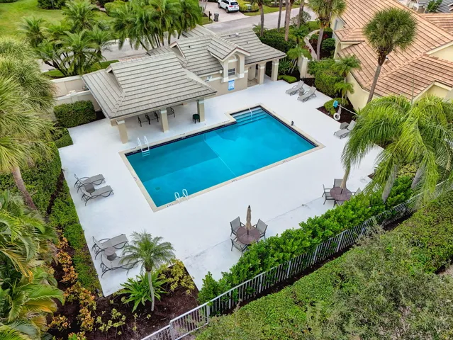 an aerial view of a house with garden space and street view