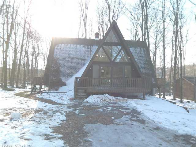 320 Alpha Avenue Winsted, CT 06098 - Photo 1 of 1 a front view of a house with a yard