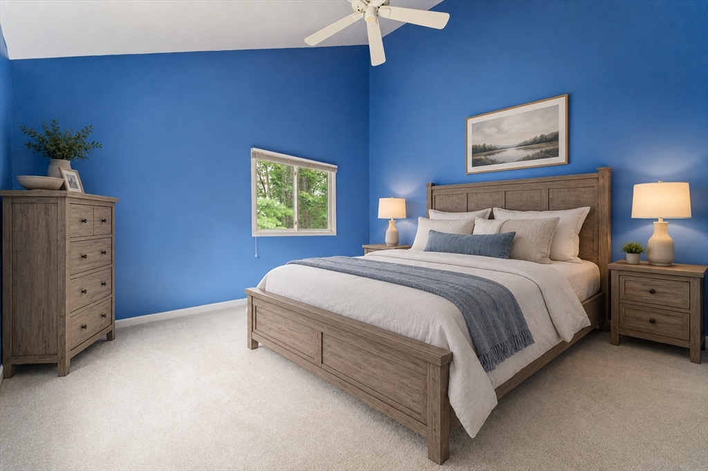 22 Arrowhead Circle, Unit 22 Ashland, MA 01721 - Photo 25 of 35 a spacious bedroom with a bed and a chandelier