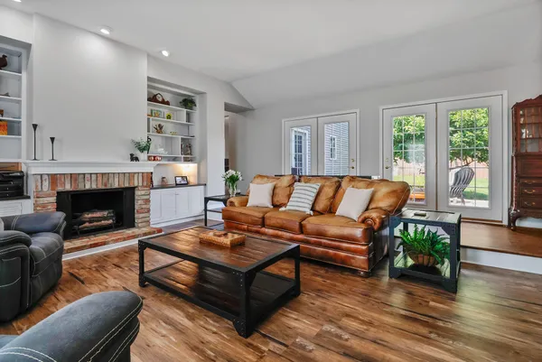 a living room with furniture and a fireplace