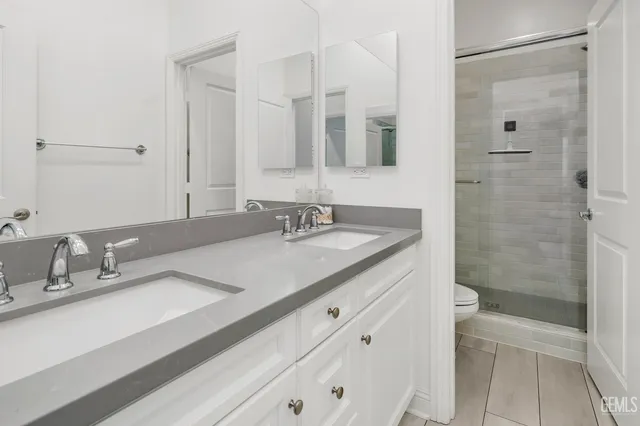 a view of a lake with a table and chairs in patio
