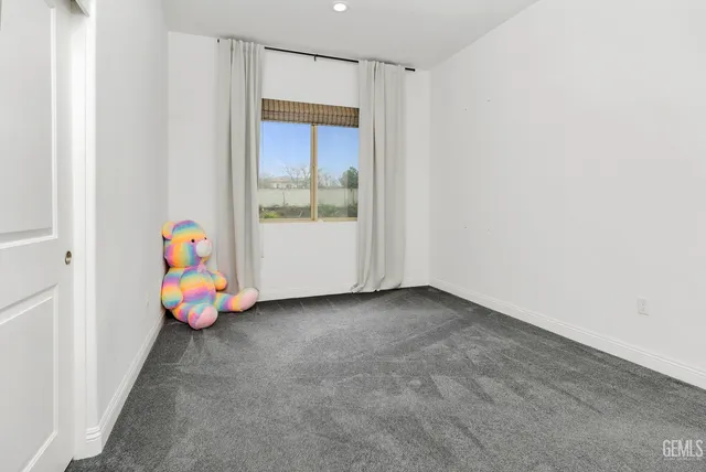 a view of a swimming pool with a yard