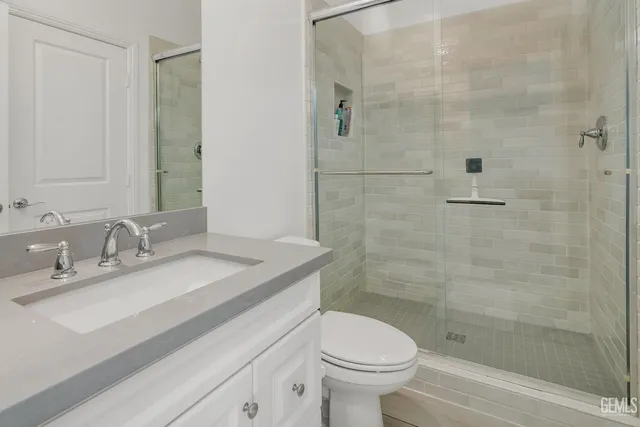 an aerial view of residential houses with outdoor space and parking