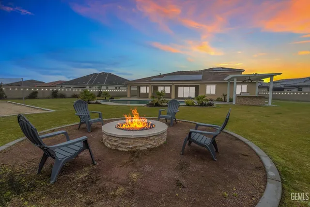an aerial view of a house with a swimming pool