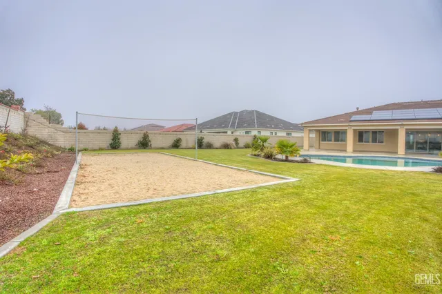 a living room with furniture a potted plant and a fireplace