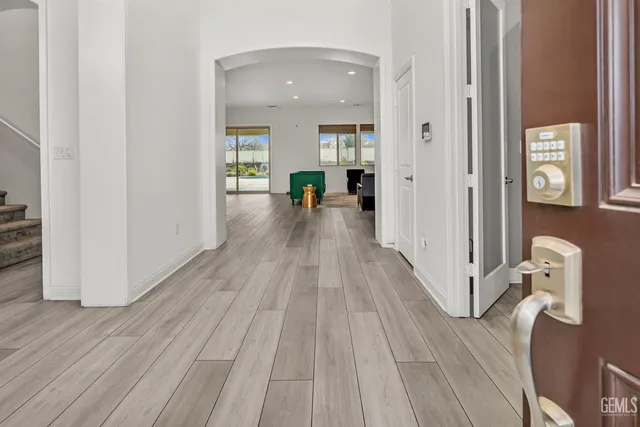 a dining room with furniture and wooden floor
