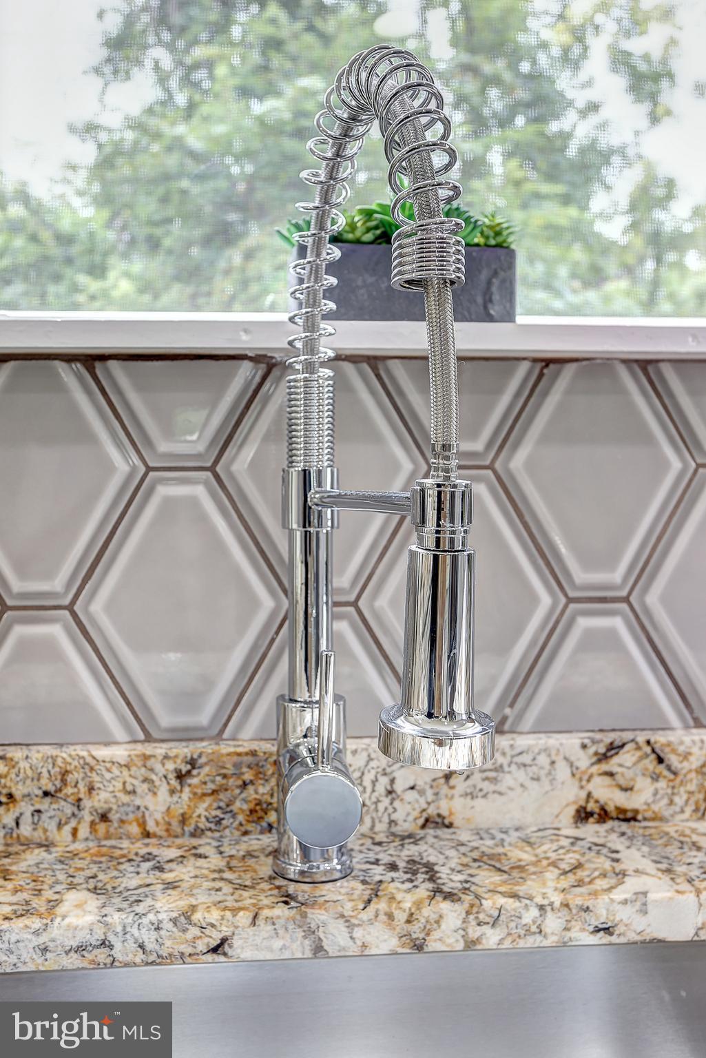 8831 Winterbrook Road Randallstown, MD 21133 - Photo 13 of 42 kitchen faucet and backsplash