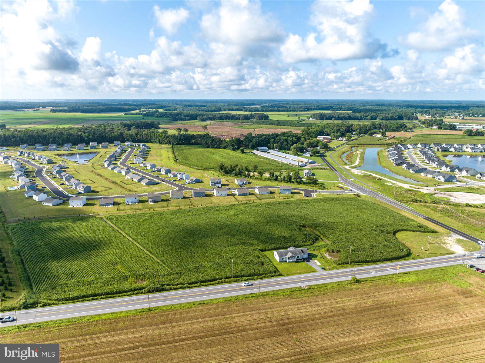 32474 Lighthouse Road Selbyville, DE 19975 - Photo 13 of 26 a view of a golf course with a lake