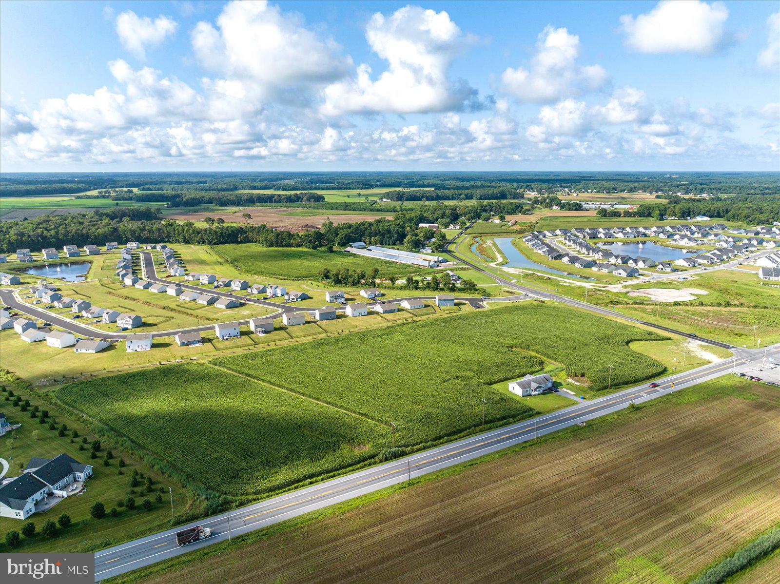 32474 Lighthouse Road Selbyville, DE 19975 - Photo 14 of 26 a view of a golf course with a big yard