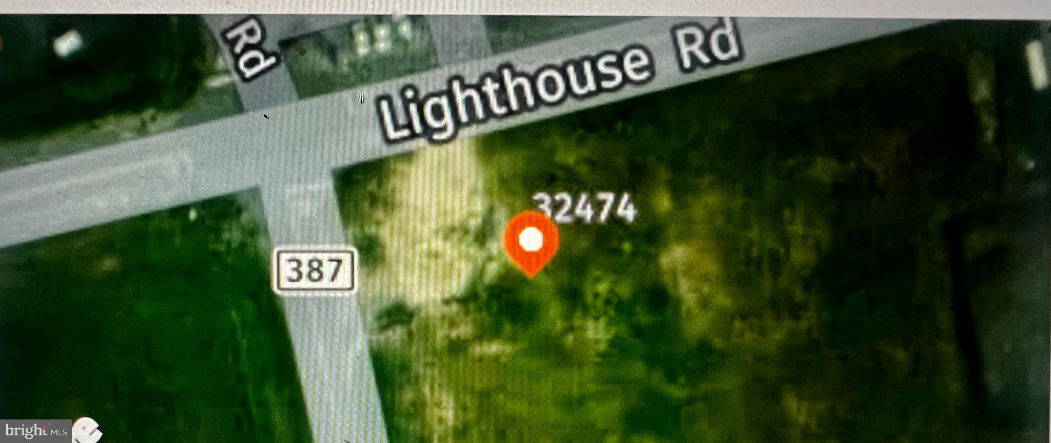 32474 Lighthouse Road Selbyville, DE 19975 - Photo 4 of 26 a close up of a street sign